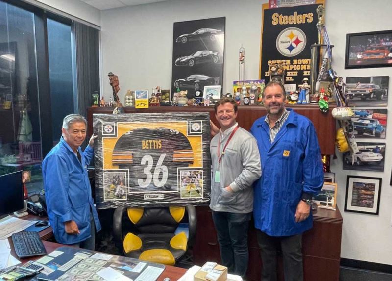 Presenting a Pittsburg Steelers jersey to CEM for purchase of 8th Yamaha machine
